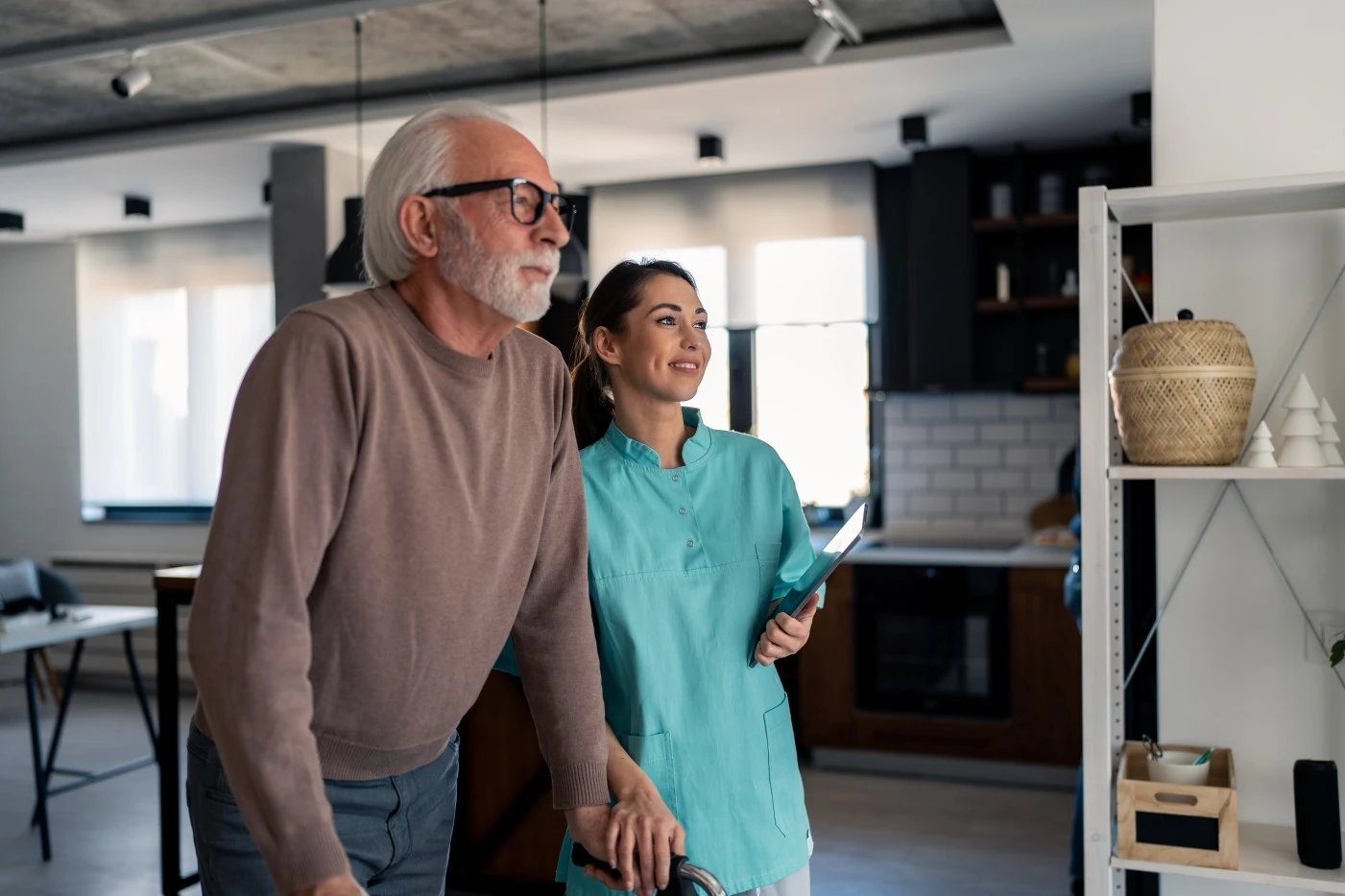 Smiling nurse with elderly man in home